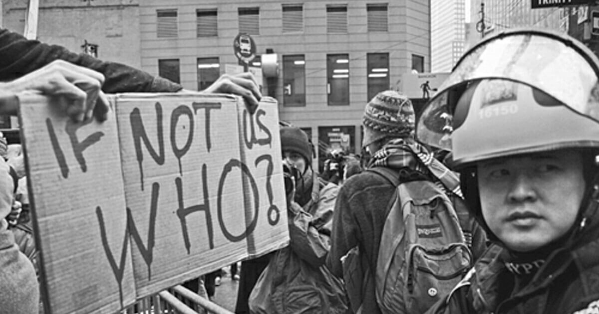 Occupy Wall Street activists facing police near Zuccotti Park in Lower Manhattan during the fall of 2011. (Riahi Brothers, Arman and Arsh T. Riahi)